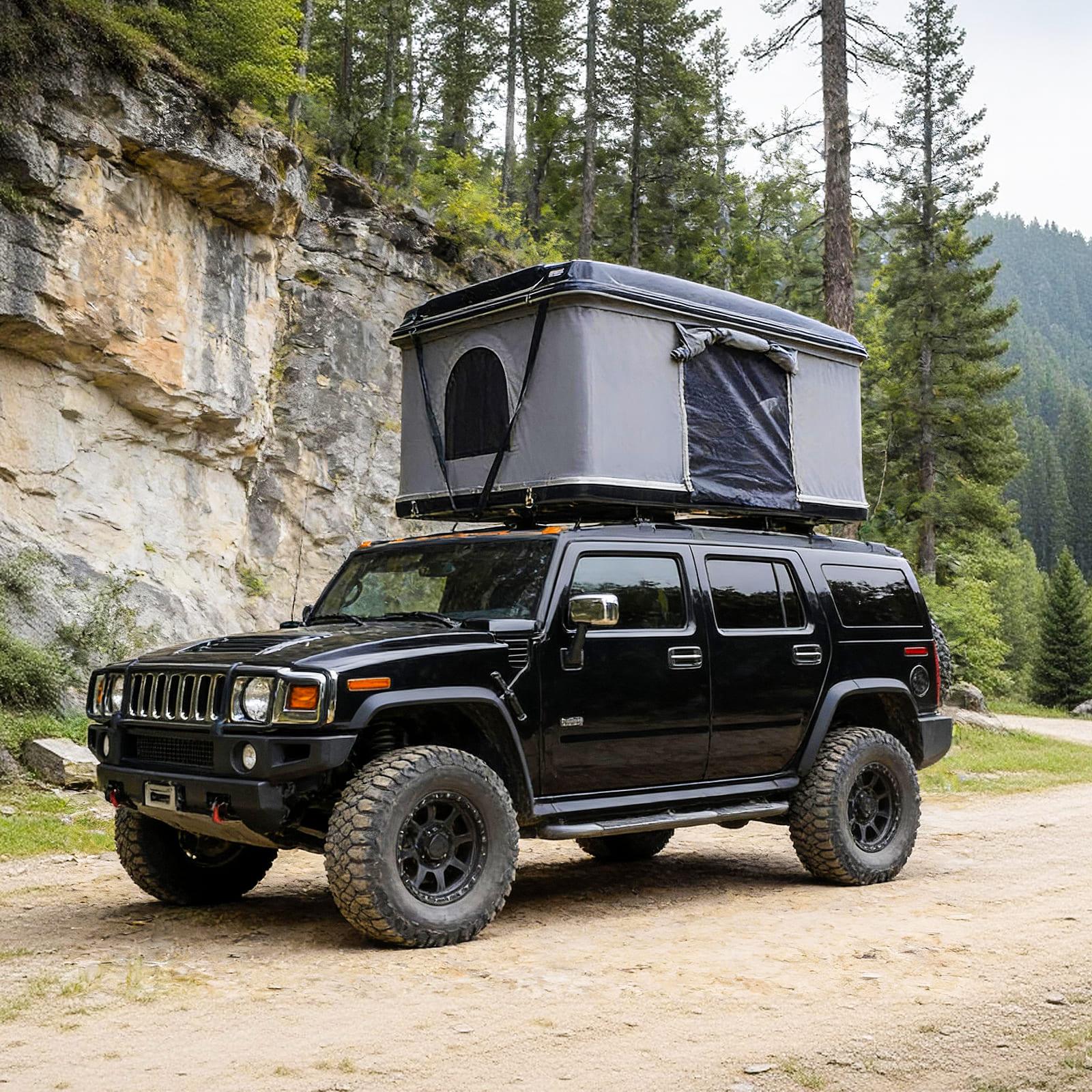 Front view of an open Everlead Fiberglass Hard Shell Roof Top Tent on a 4x4 vehicle. The hydraulic pop-up tent features a grey 3000mm waterproof canvas body, large mesh windows, and an extended rain fly, ready for camping.