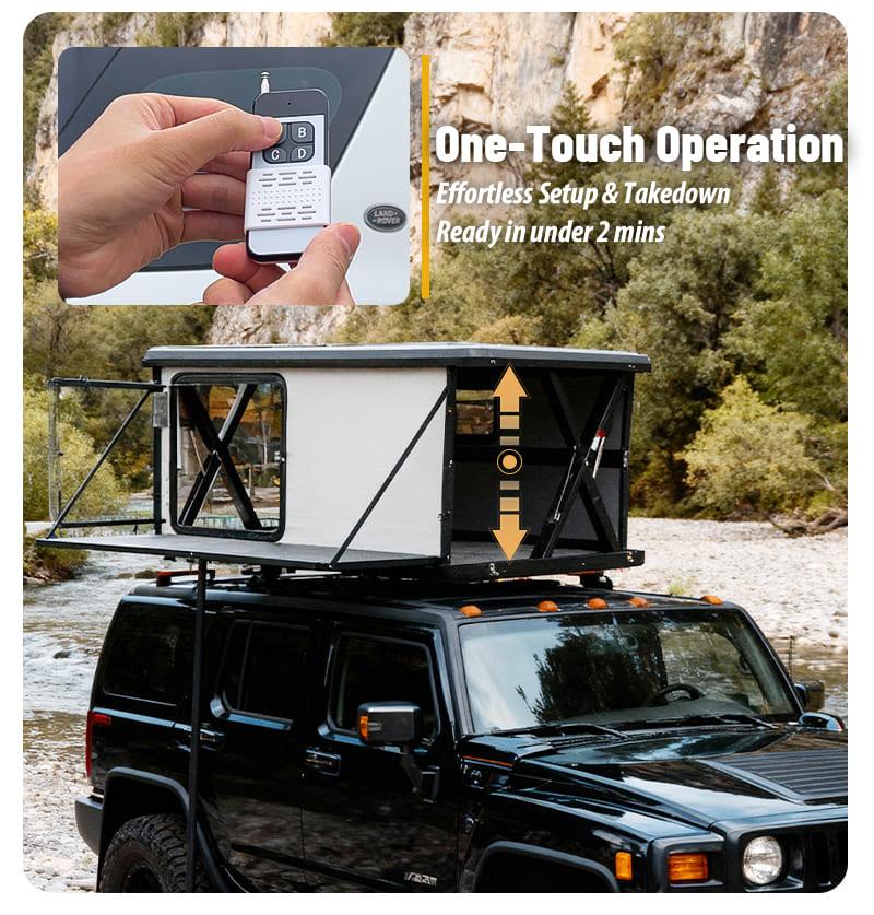 Hand holding a wireless remote control activating the instant setup mechanism of the automatic hard shell roof top tent