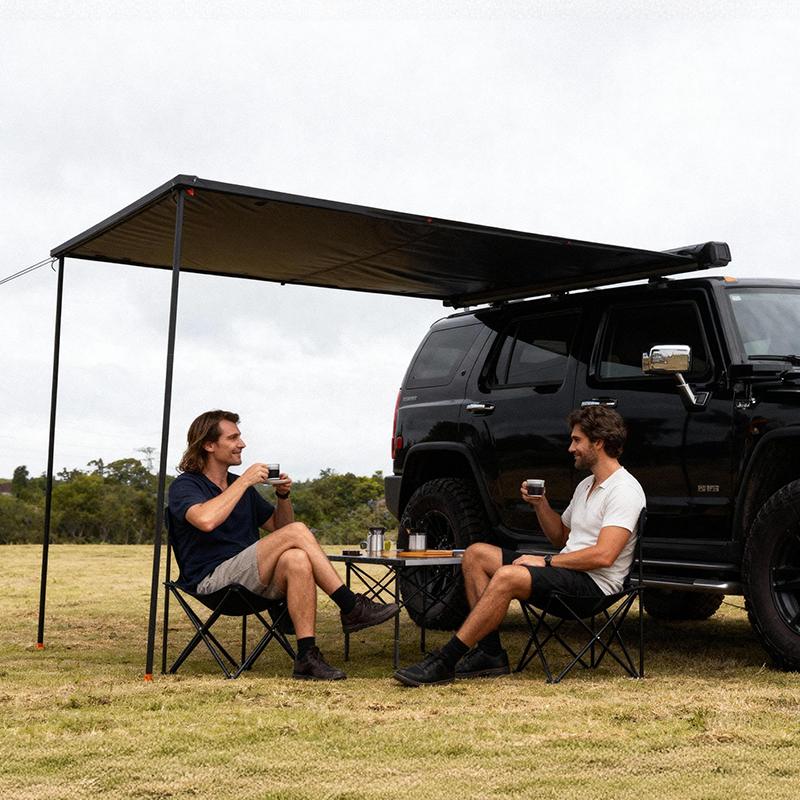 Retractable car side awning with auto-roll mechanism deployed on an SUV roof rack.