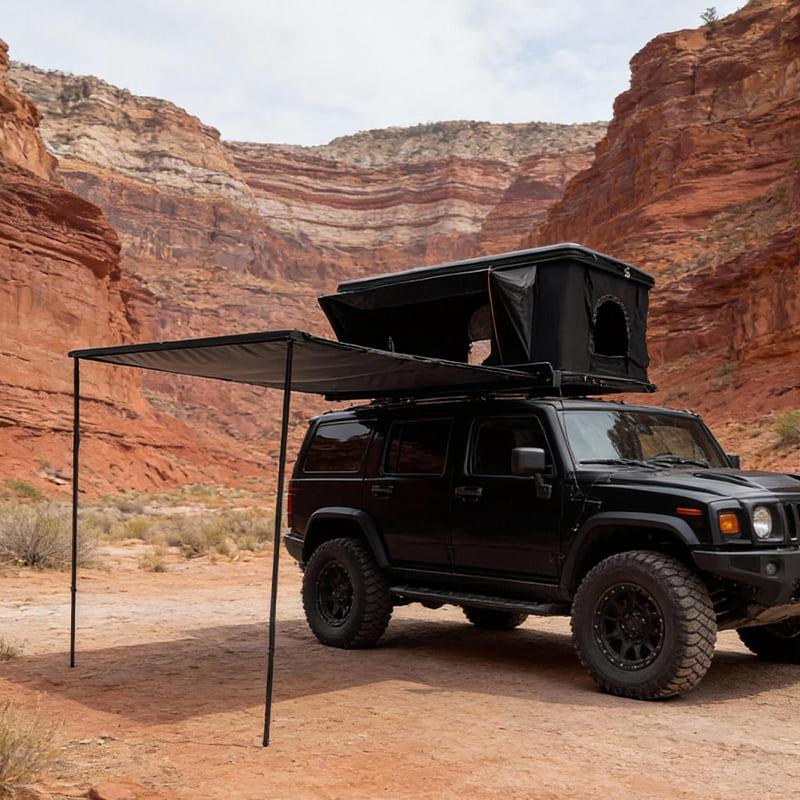 Everlead Aluminum Hardshell Awning deployed on a black Hummer. Features a sleek black case and manual retractable rectangular shade.