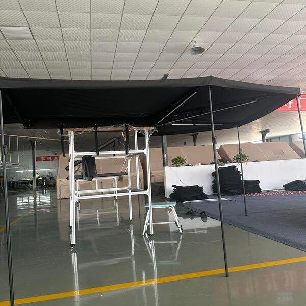 Finished vehicle side awning mounted and ready for outdoor sun protection.