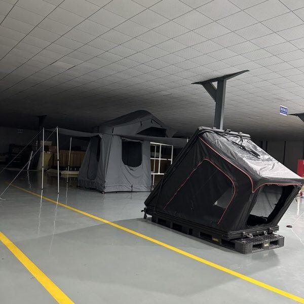 Wedge hard shell rooftop tent with attached annex room for extra living space.