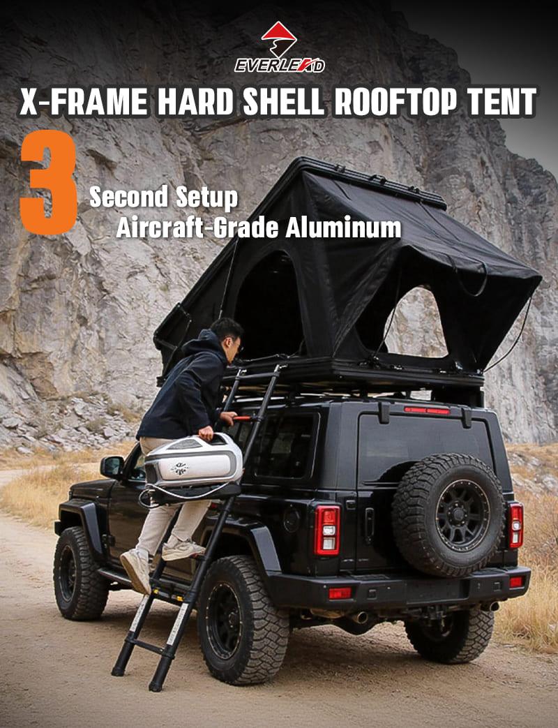 X-Frame Hard Shell Rooftop Tent mounted on black Jeep Wrangler