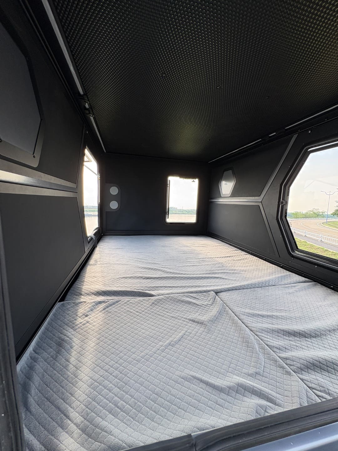 Inside the DC-03 smart rooftop tent featuring the 190 by 125 cm sleeping space and 3 cm foam mattress