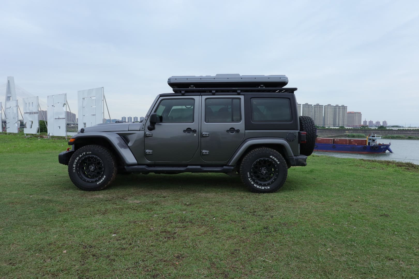 Side profile of the electric hard shell rooftop tent demonstrating its 19 cm low-profile design