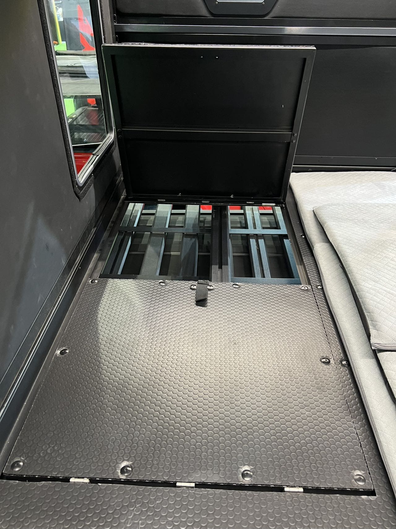 Interior vehicle view showing direct sunroof entry access into the electric roof top tent